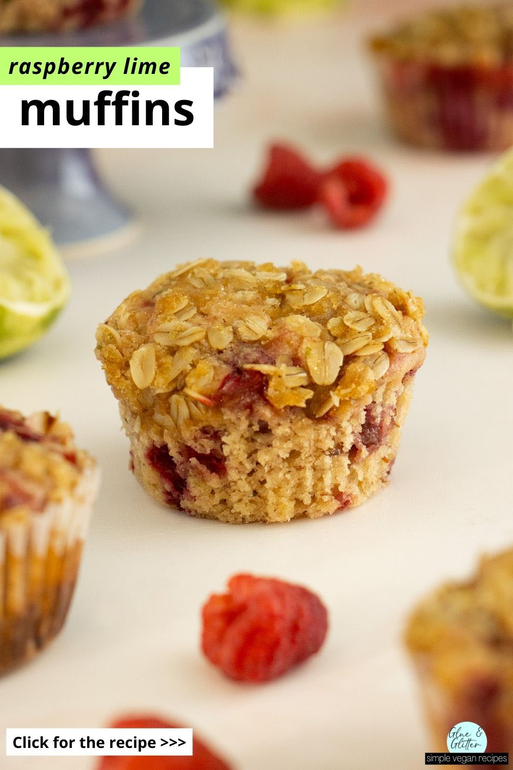 vegan raspberry muffins on a table with raspberries around them, text overlay