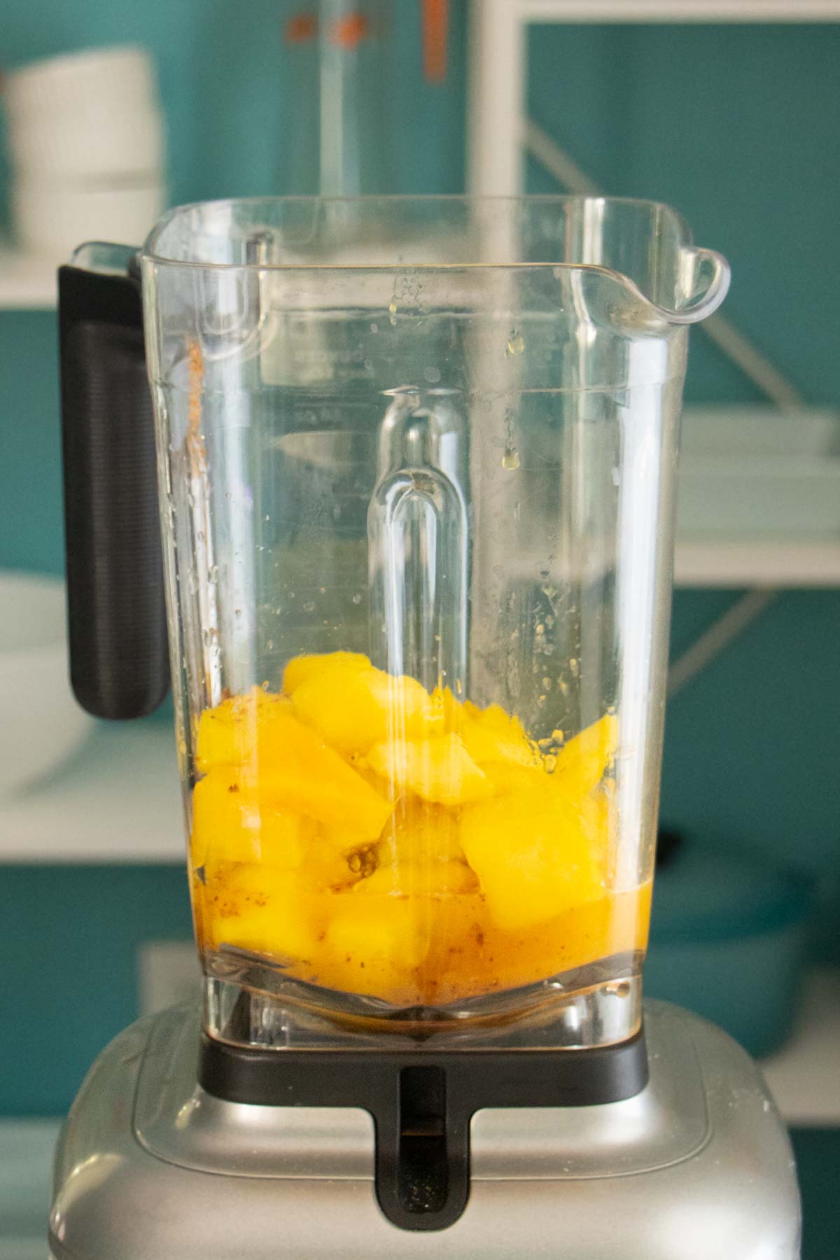 Mango Tajin popsicle ingredients in the blender after blending