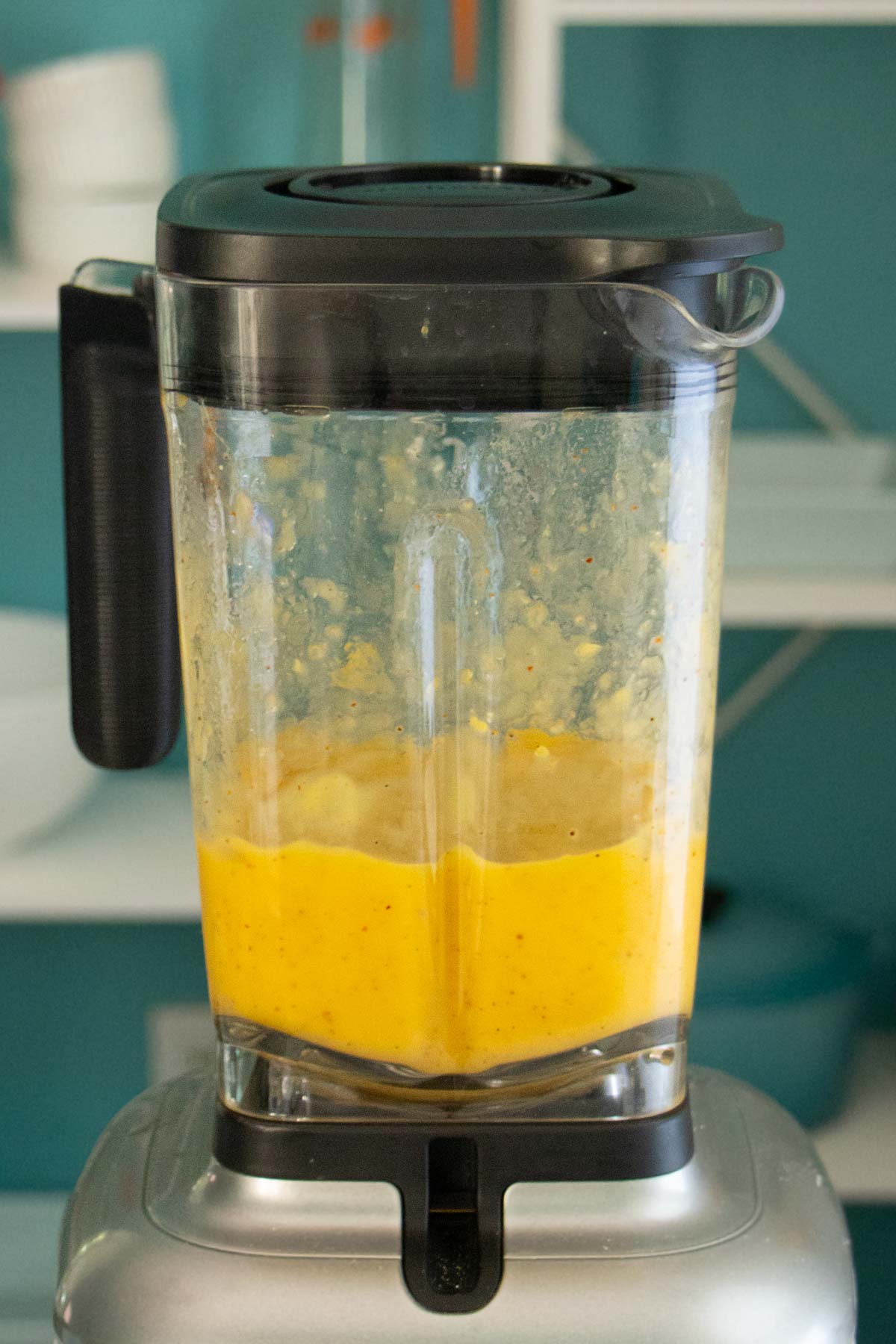 Mango Tajin popsicle ingredients in the blender before blending