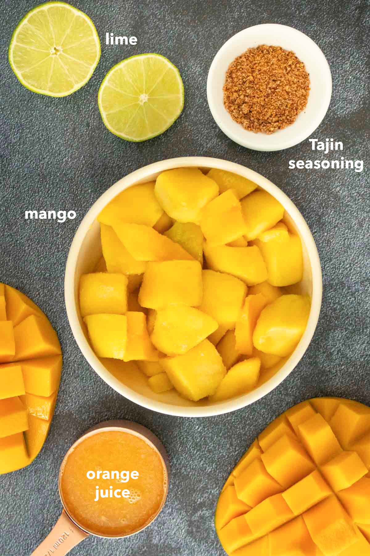 Mango Tajin popsicle ingredients on a kitchen counter