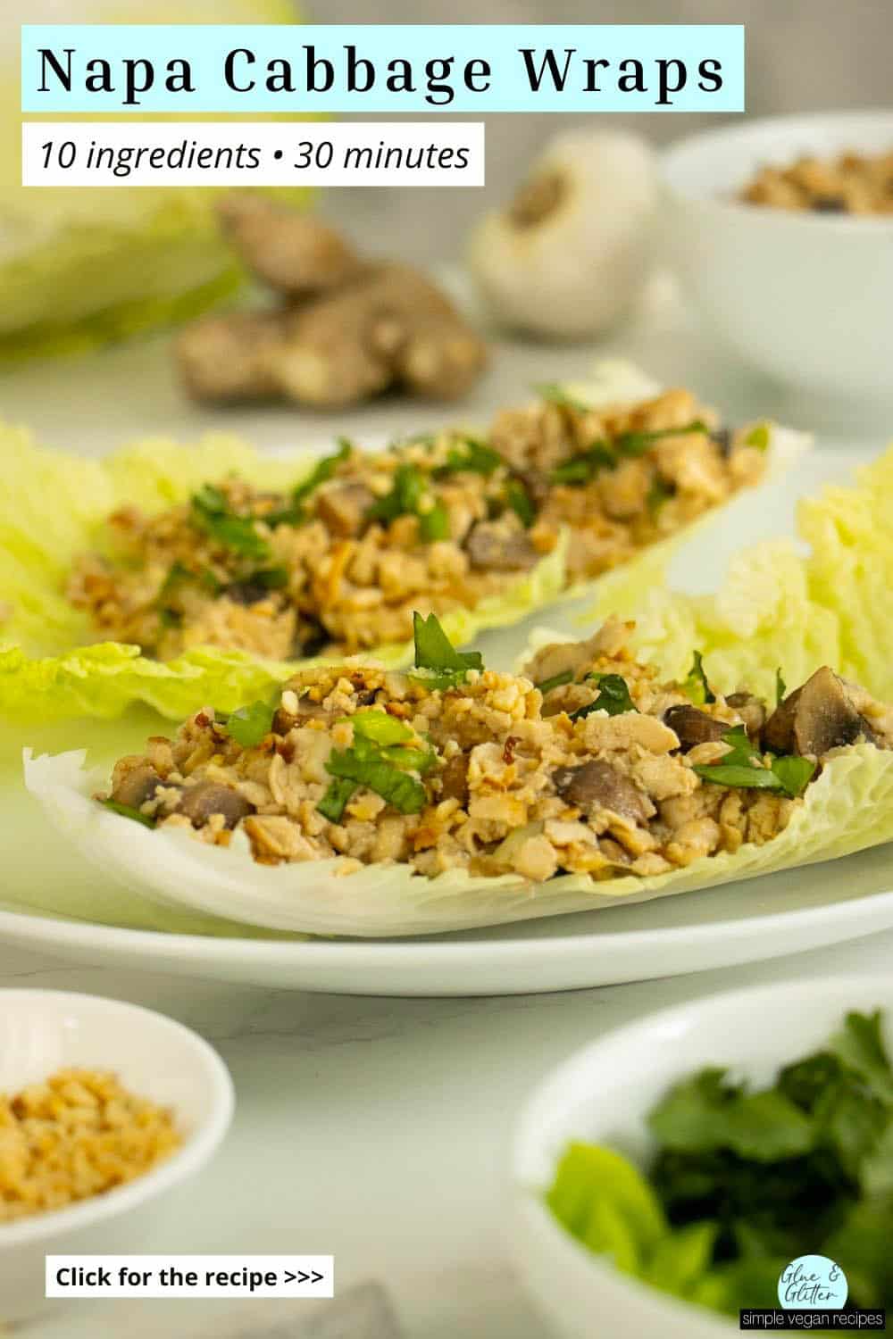 napa cabbage wraps on a white plate surrounded by toppings in bowls, text overlay