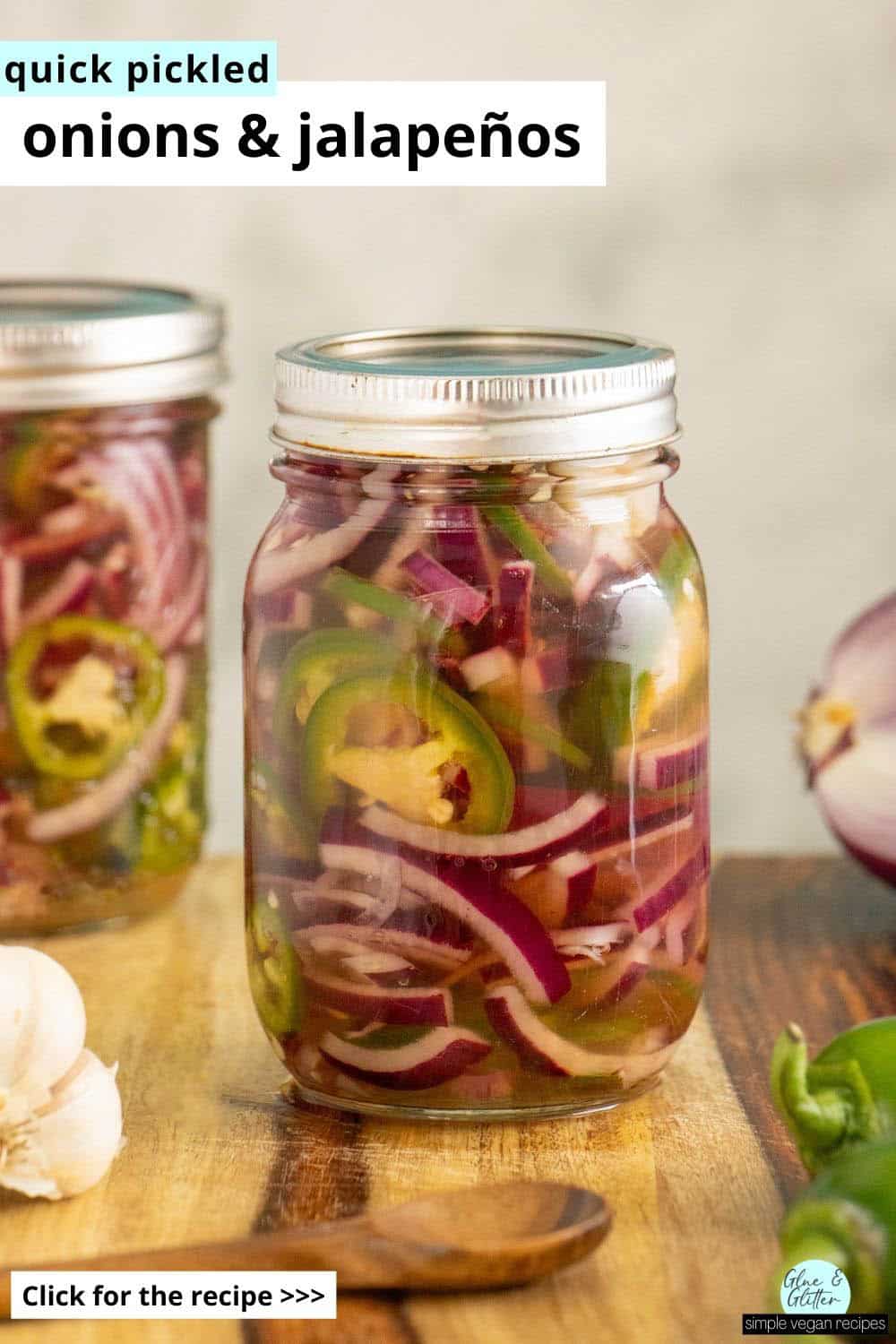 jars of pickled onions and on a wooden countertop with veggies around them, text overlay