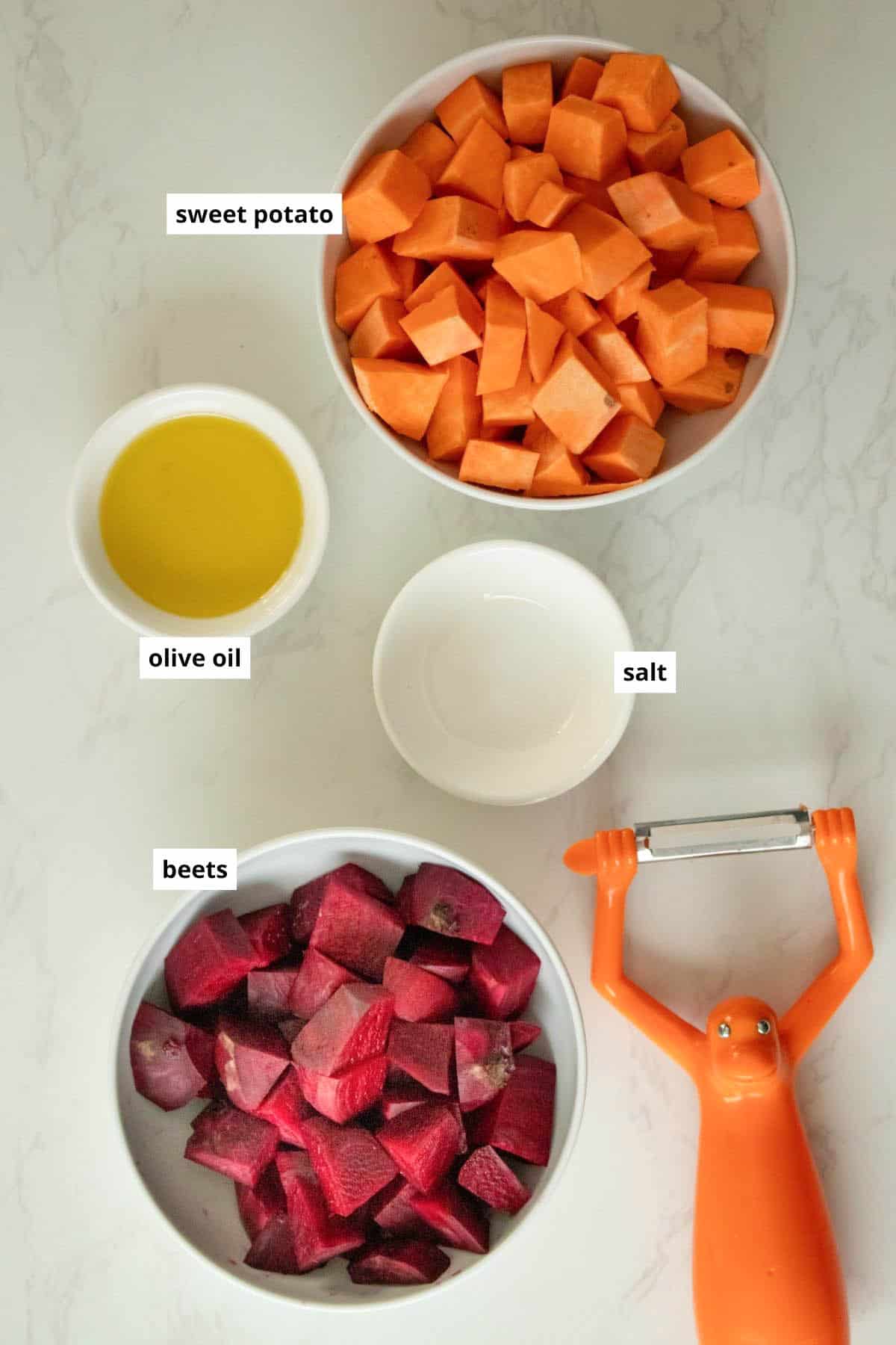 beets, sweet potatoes, olive oil, and salt in cups on a white table