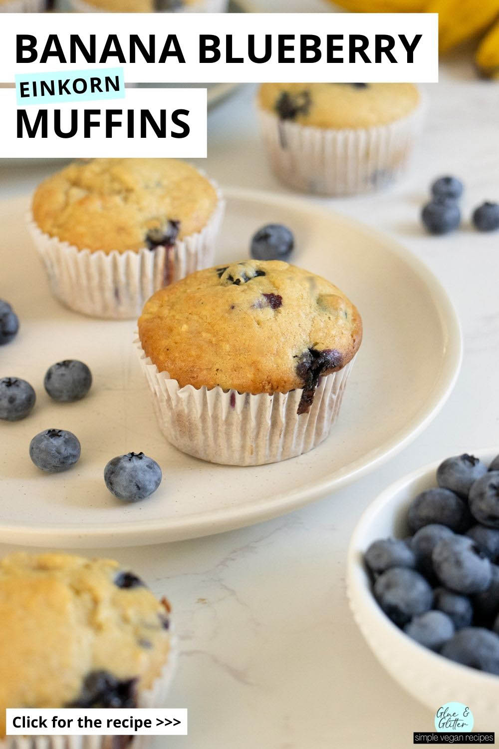 einkorn blueberry muffins plates with blueberries and bananas on the table around them, text overlay