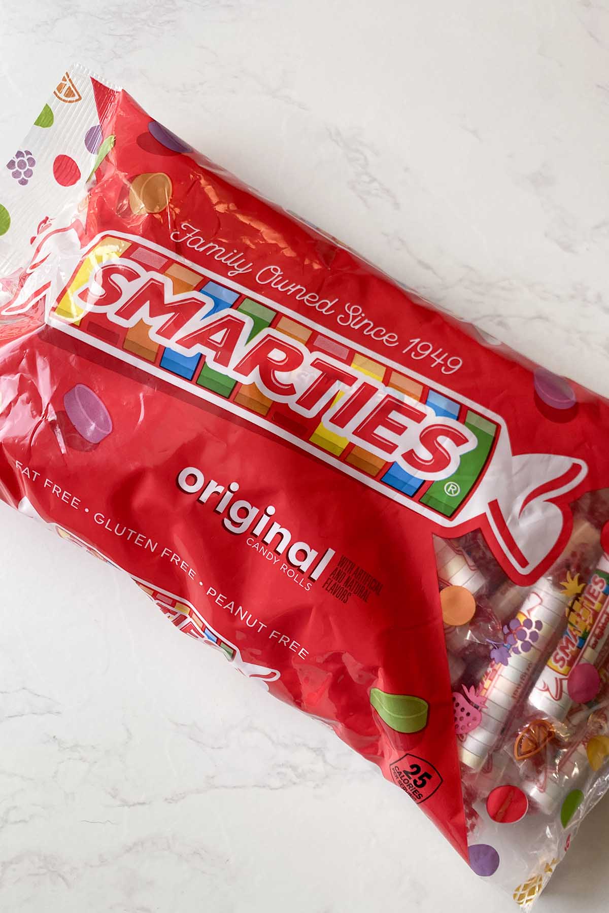 bag of Smarties on a white table