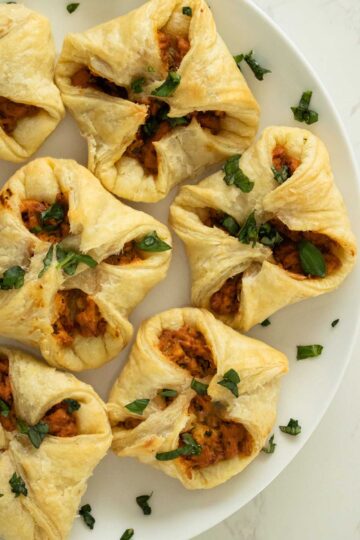 tomato basil tofu puff pastry on a white plate