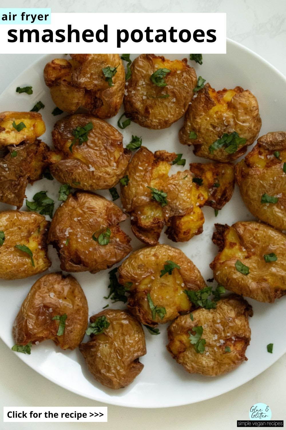 air fryer smashed potatoes topped with sea salt and fresh herbs, text overlay