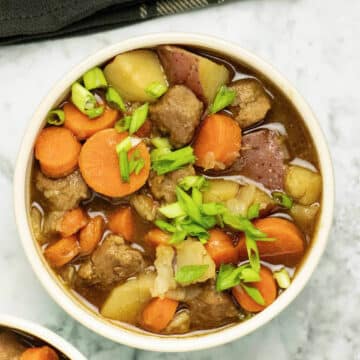 bowl of vegan beef stew on a white table