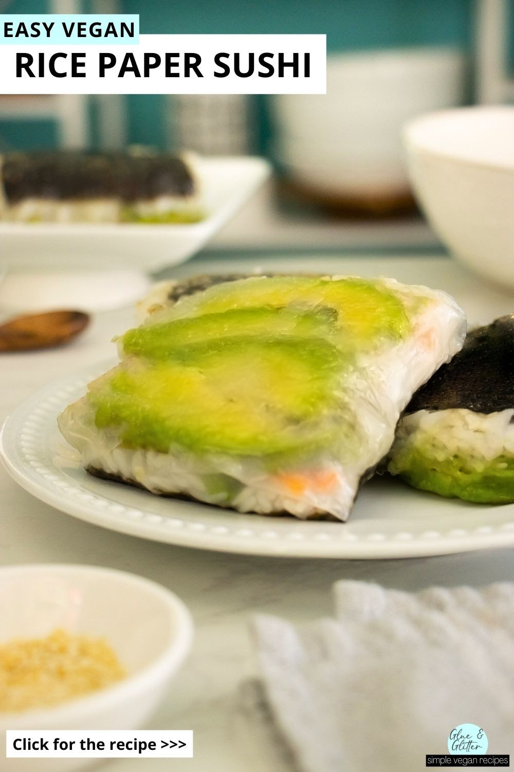 rice paper sushi with avocado and pickled carrots on a white plate, text overlay