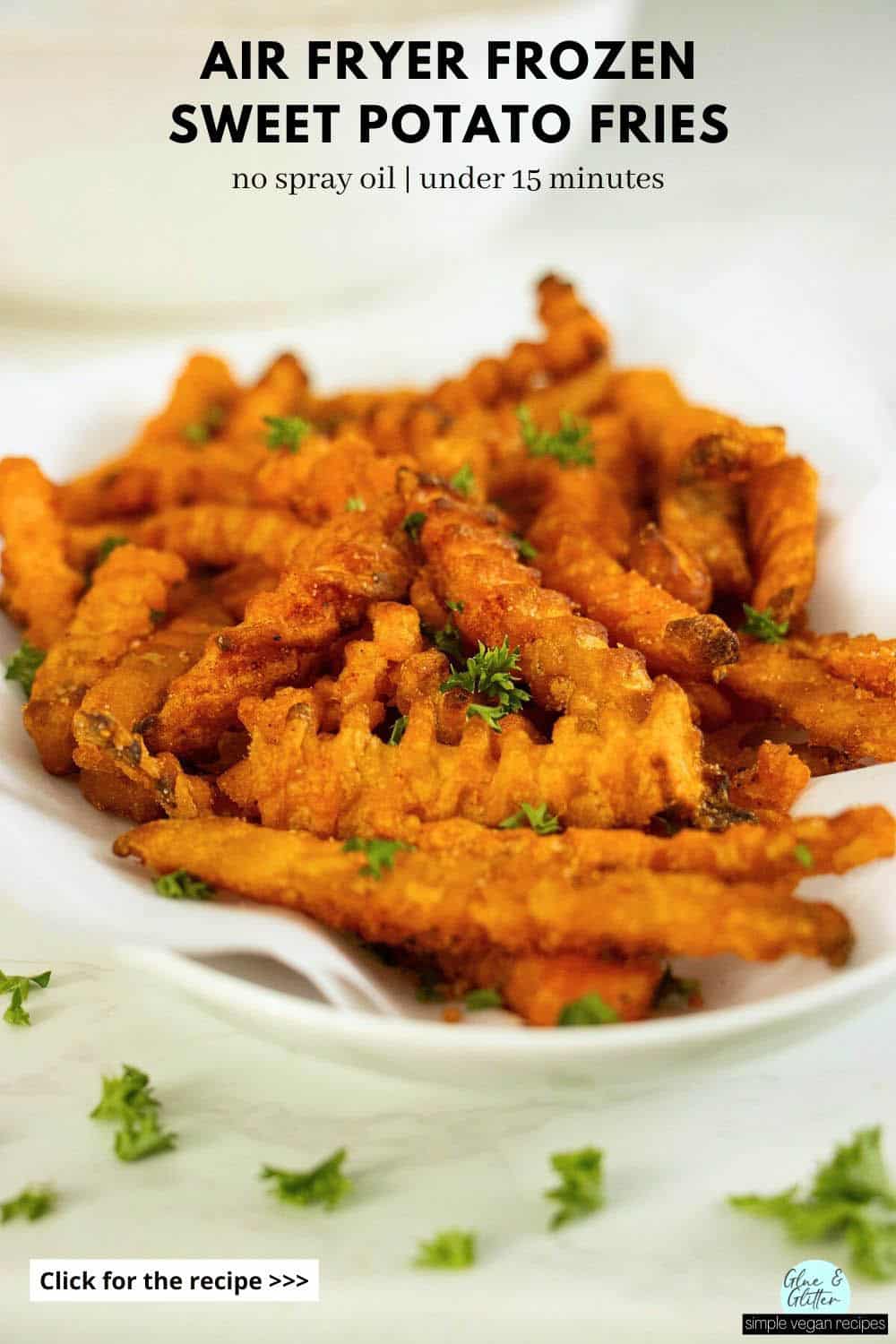 air fryer frozen sweet potato fries on a serving tray after cooking and seasoning, text overlay