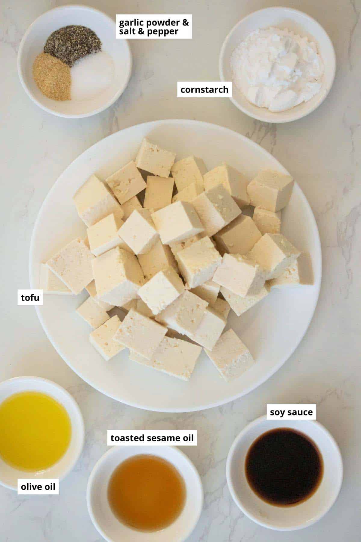 crispy tofu ingredients in bowls on a white table