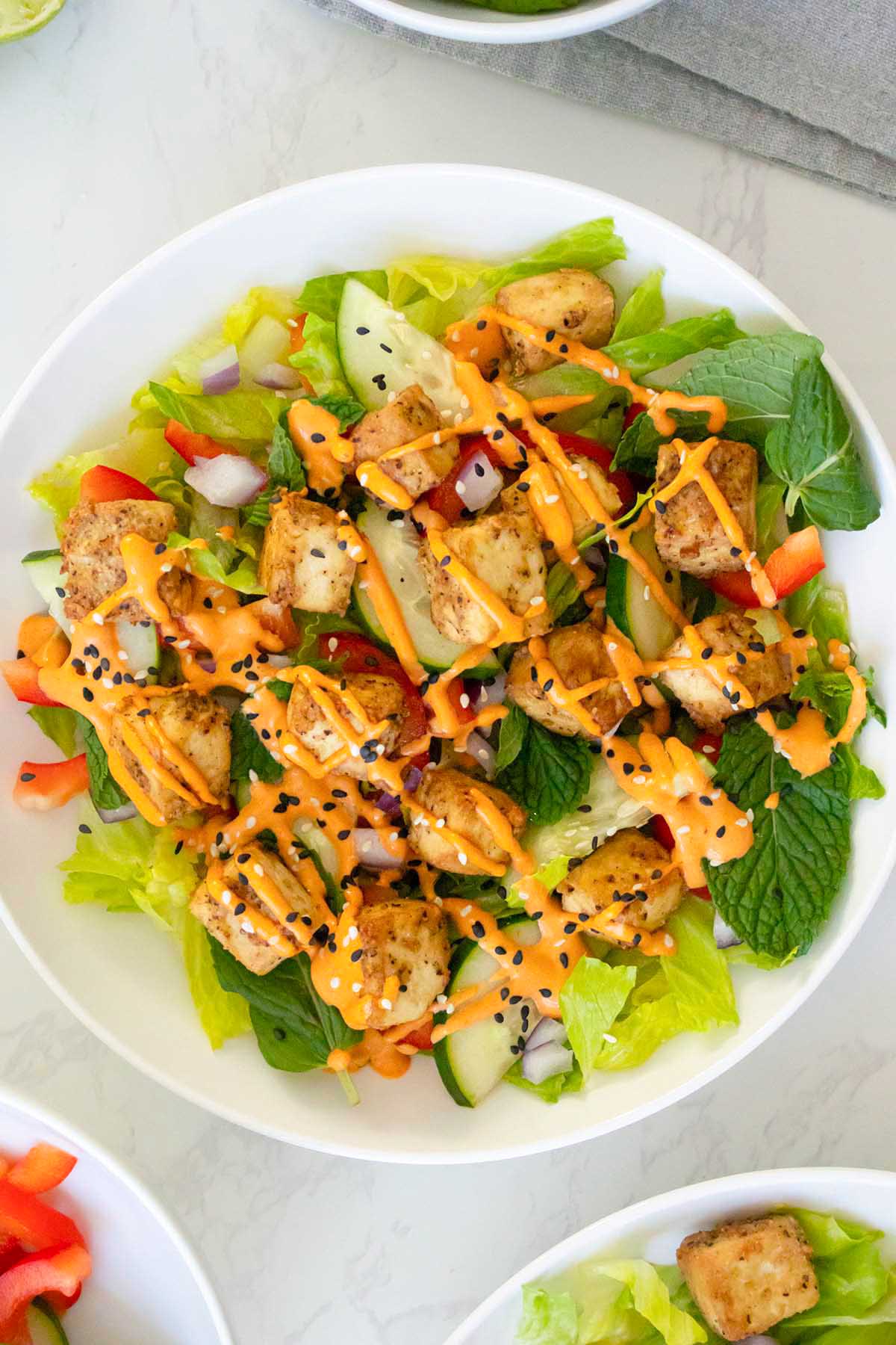 close-up of the gochujang salad topped with sesame seeds