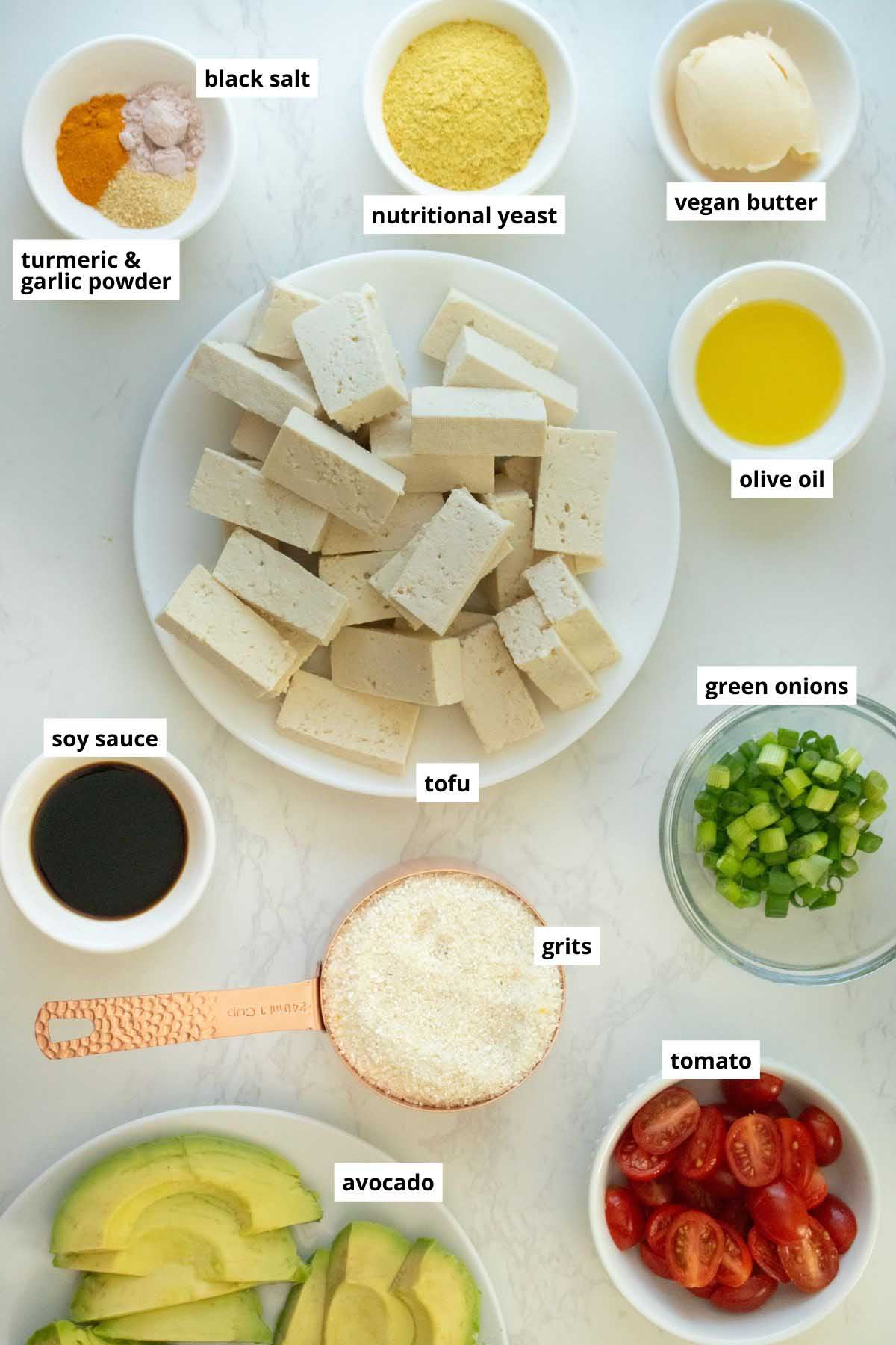 grits, tofu, and other grits bowls ingredients in bowls on a white table