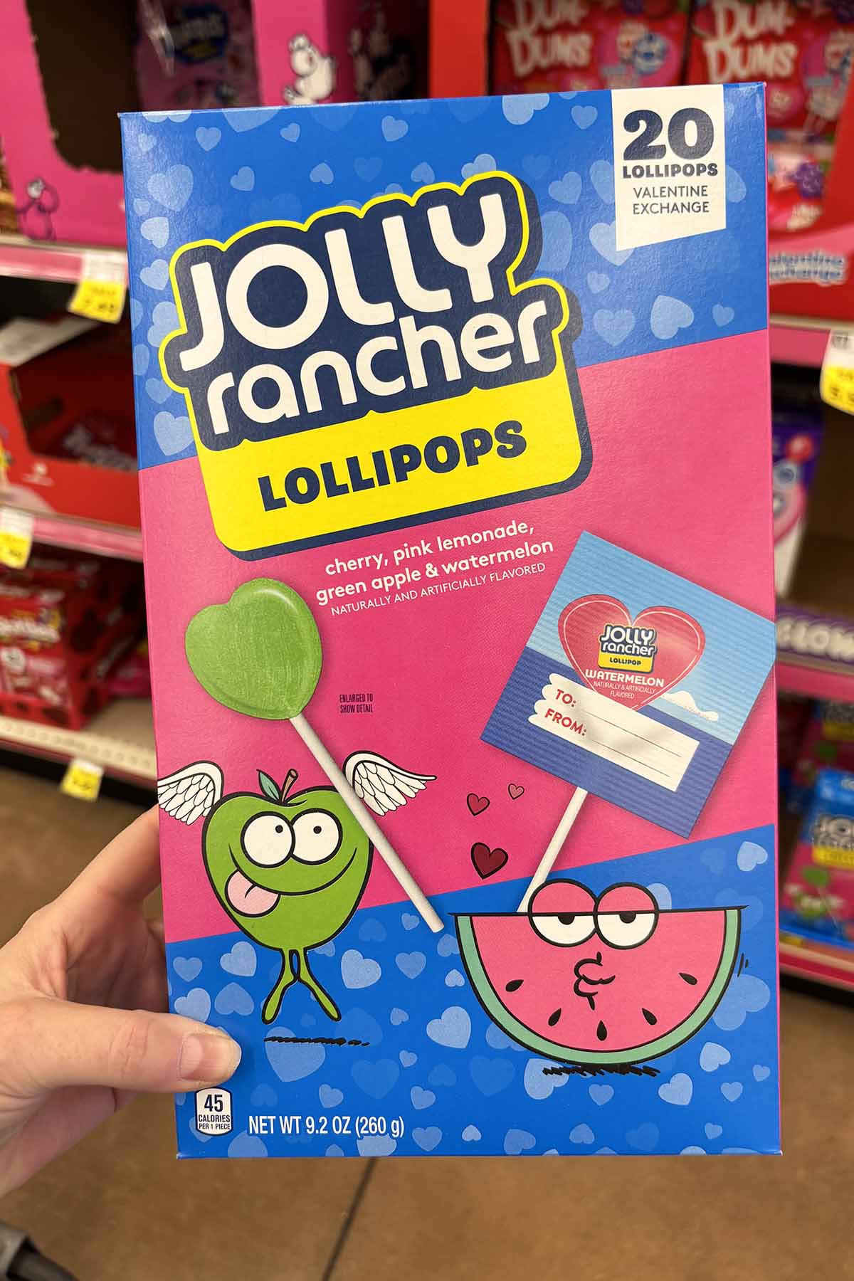 hand holding a box of Jolly Rancher Lollipops Valentines