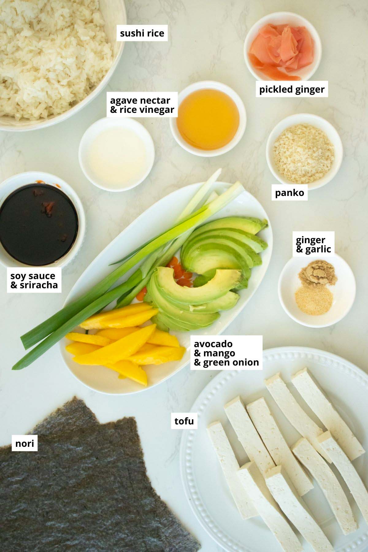 sushi burrito ingredients arranged on a white table