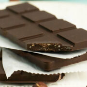 close-up of stack of vegan crunch bars with a bite out of one bar