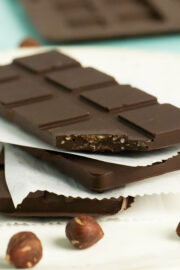 close-up of stack of vegan crunch bars with a bite out of one bar