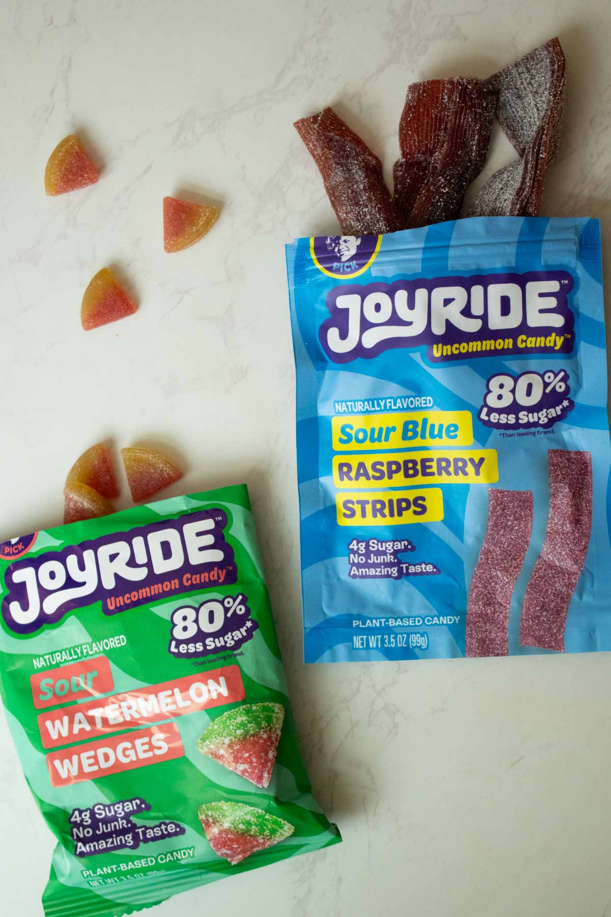 open bags of vegan gum candy: Joyride Sour Watermelon Wedges and Joyride Blue Raspberry Sour Strips