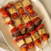 baked tofu skewers on the serving platter