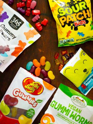 array of vegan gummy candy bags on a wood table