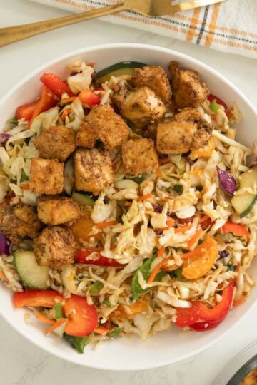vegan asian salad in a bowl with crispy tofu