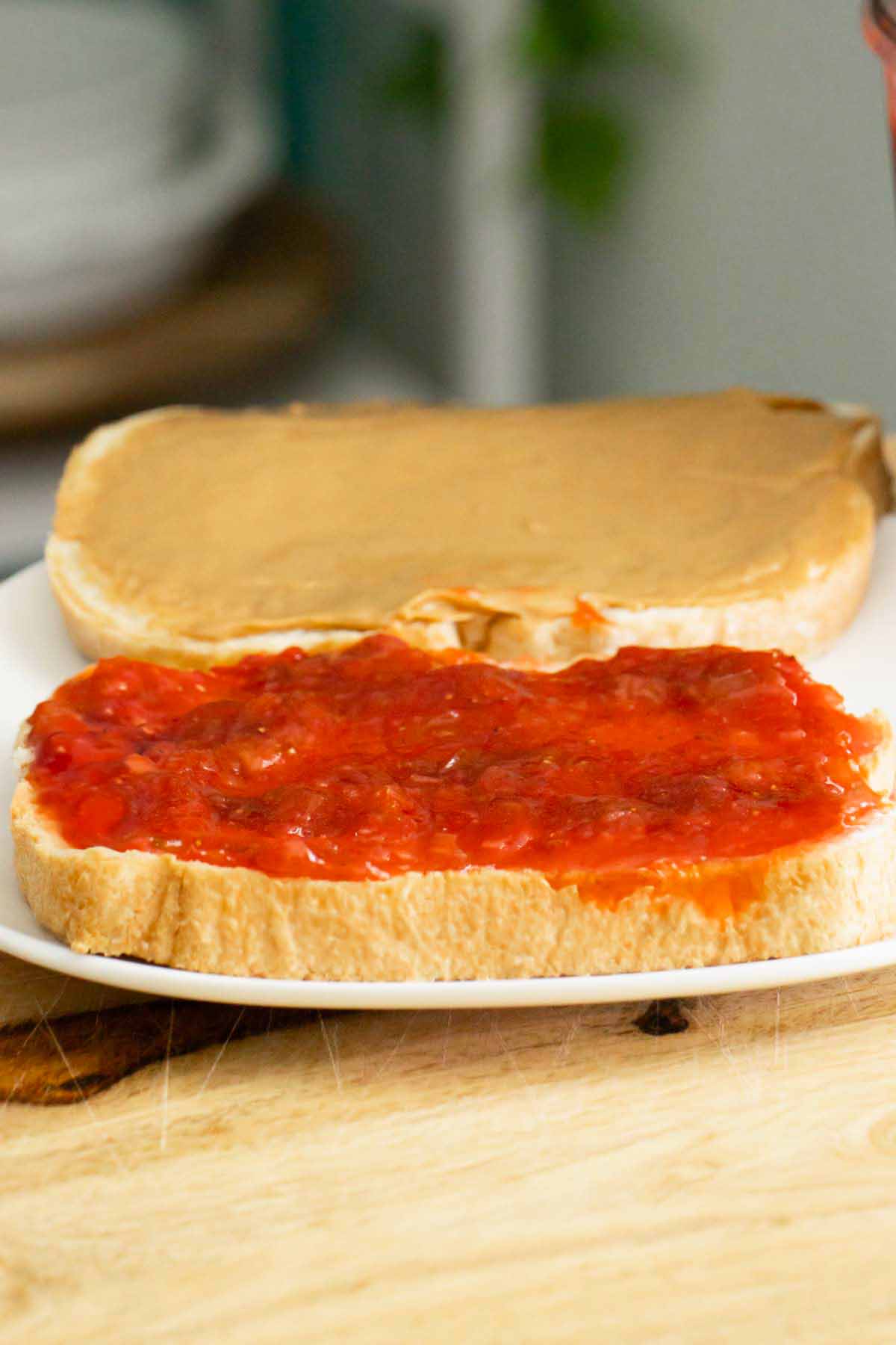 making a PBJ using strawberry rhubarb freezer jam