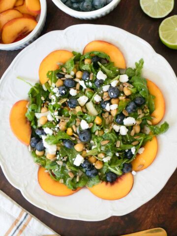 blueberry peach salad on a white plate