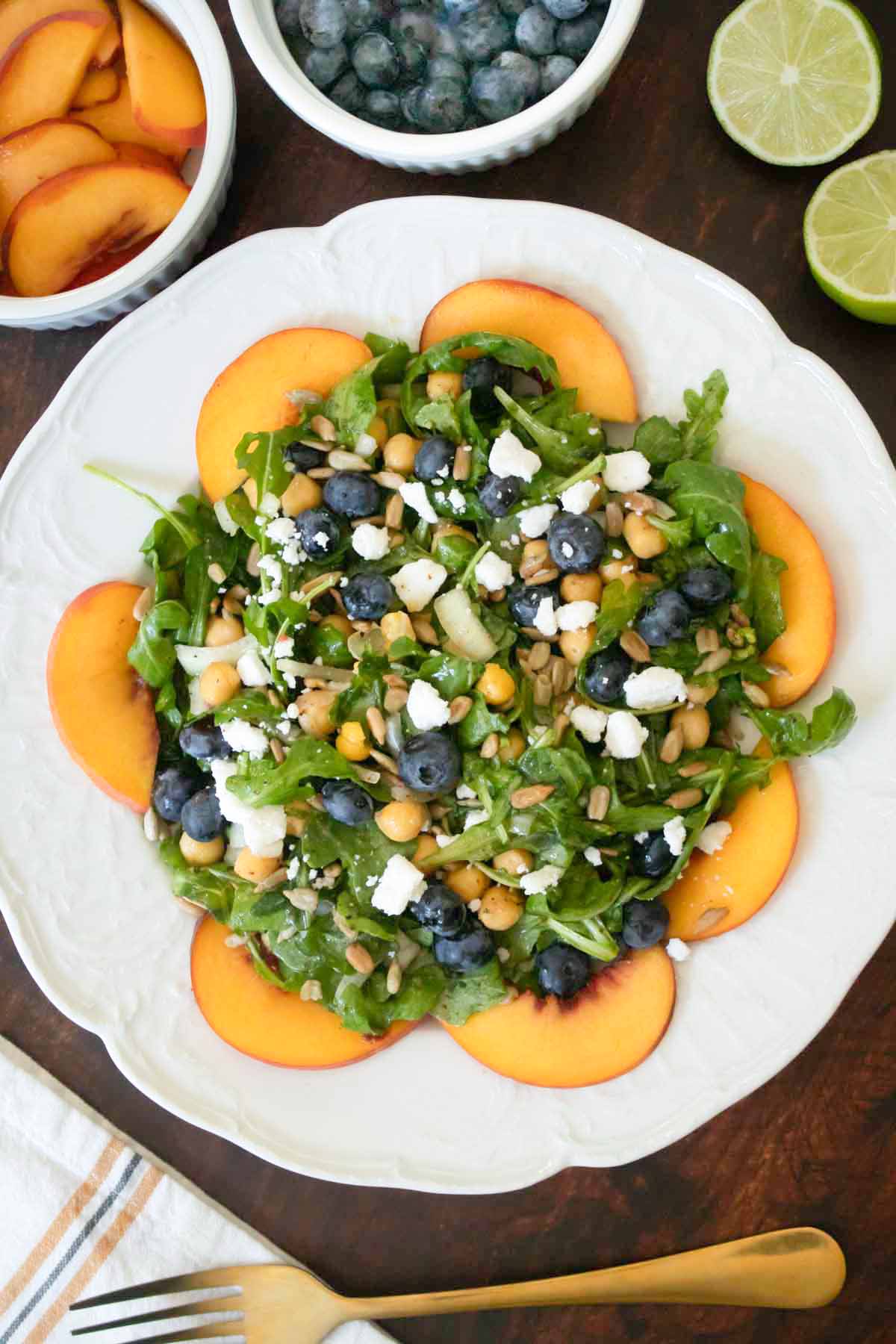 blueberry peach salad on a white plate