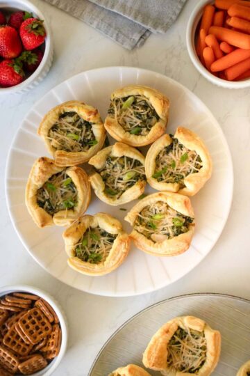 spinach artichoke puff pastry as part of a holiday party spread