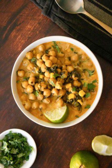 coconut-free chickpea curry in a bowl topped with cilantro and lime