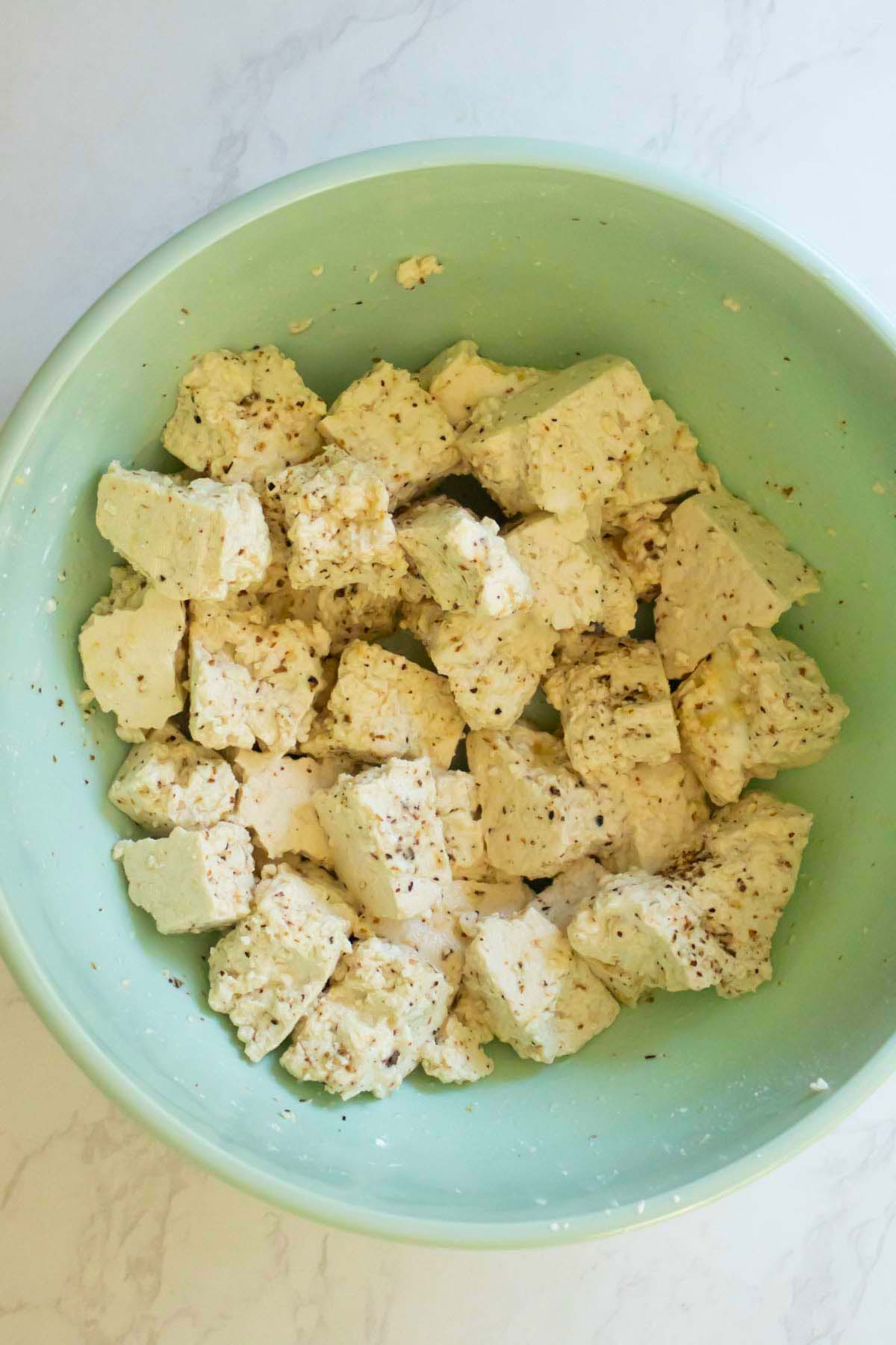 seasoned tofu in the mixing bowl