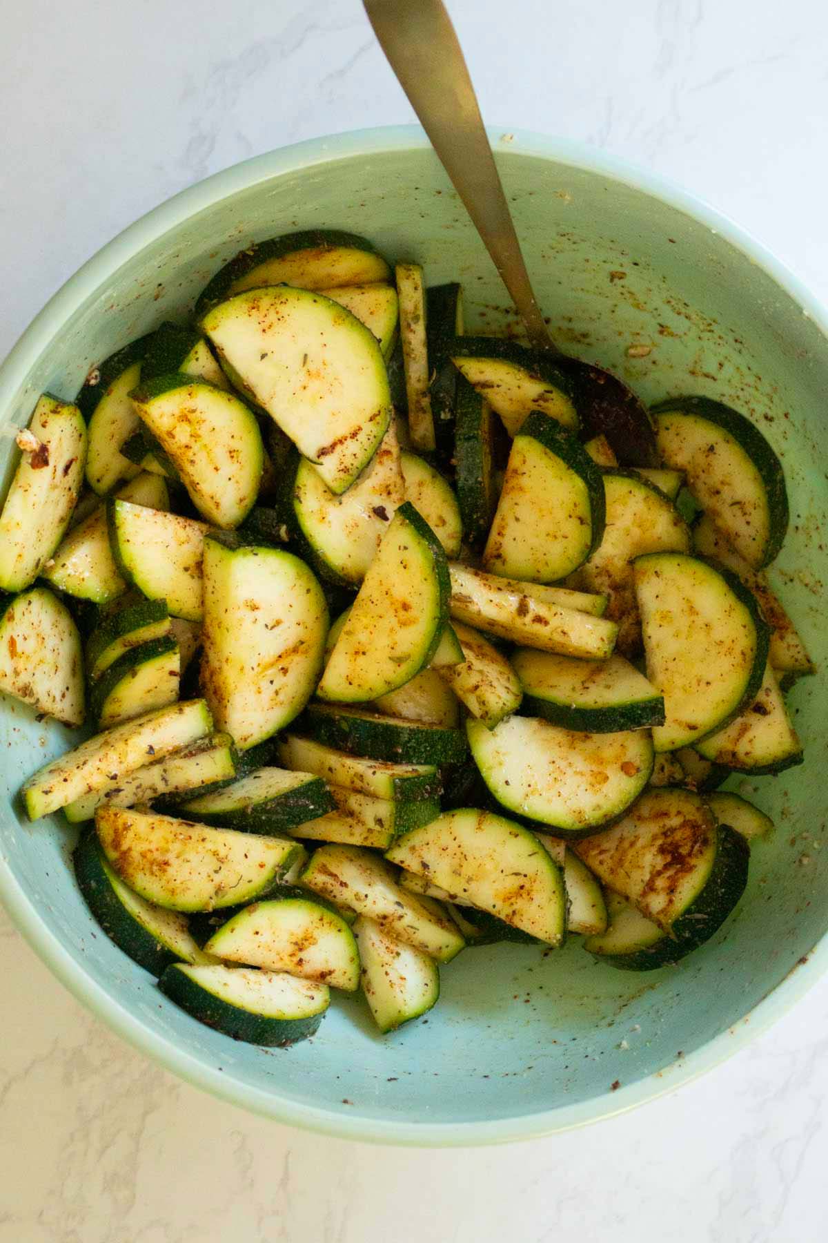 seasoned zucchini in the mixing bowl