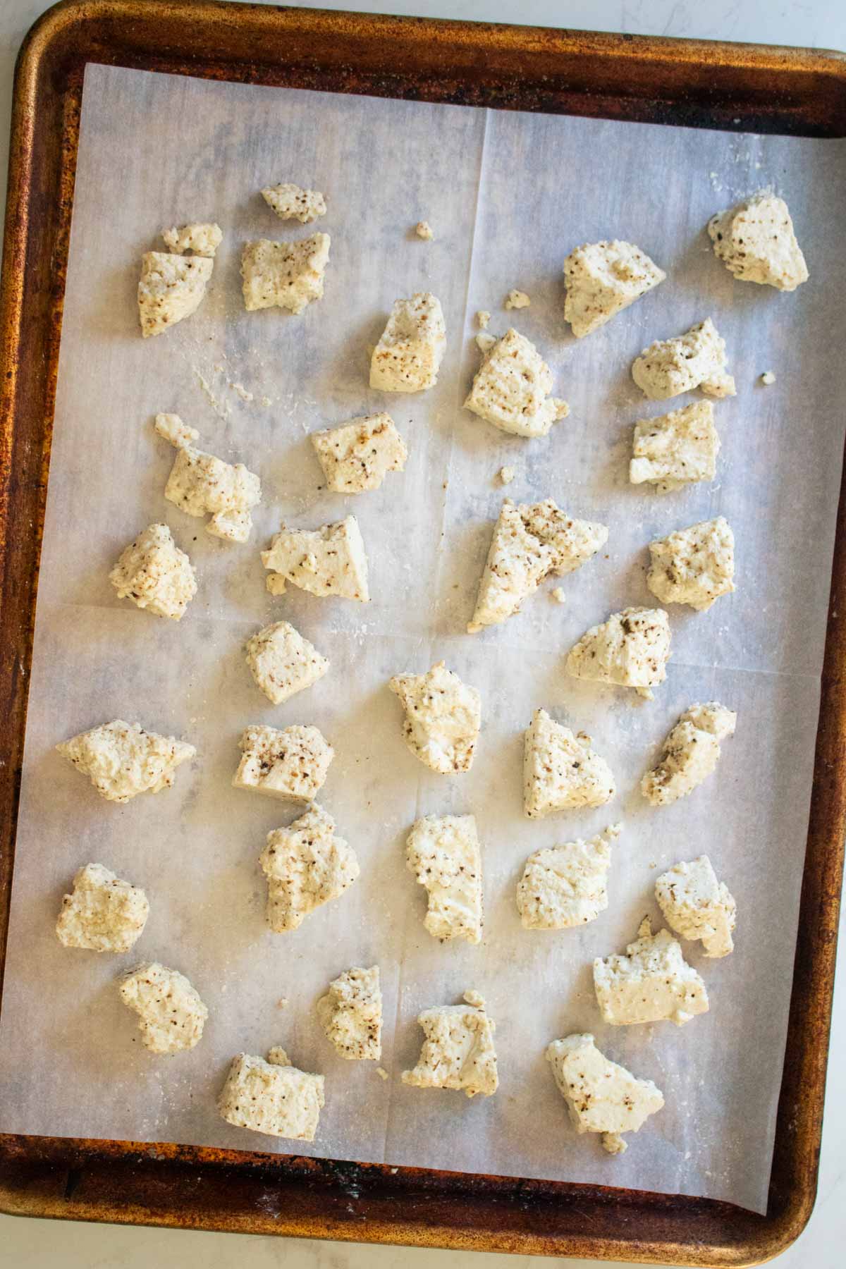 tofu on the baking sheet before baking