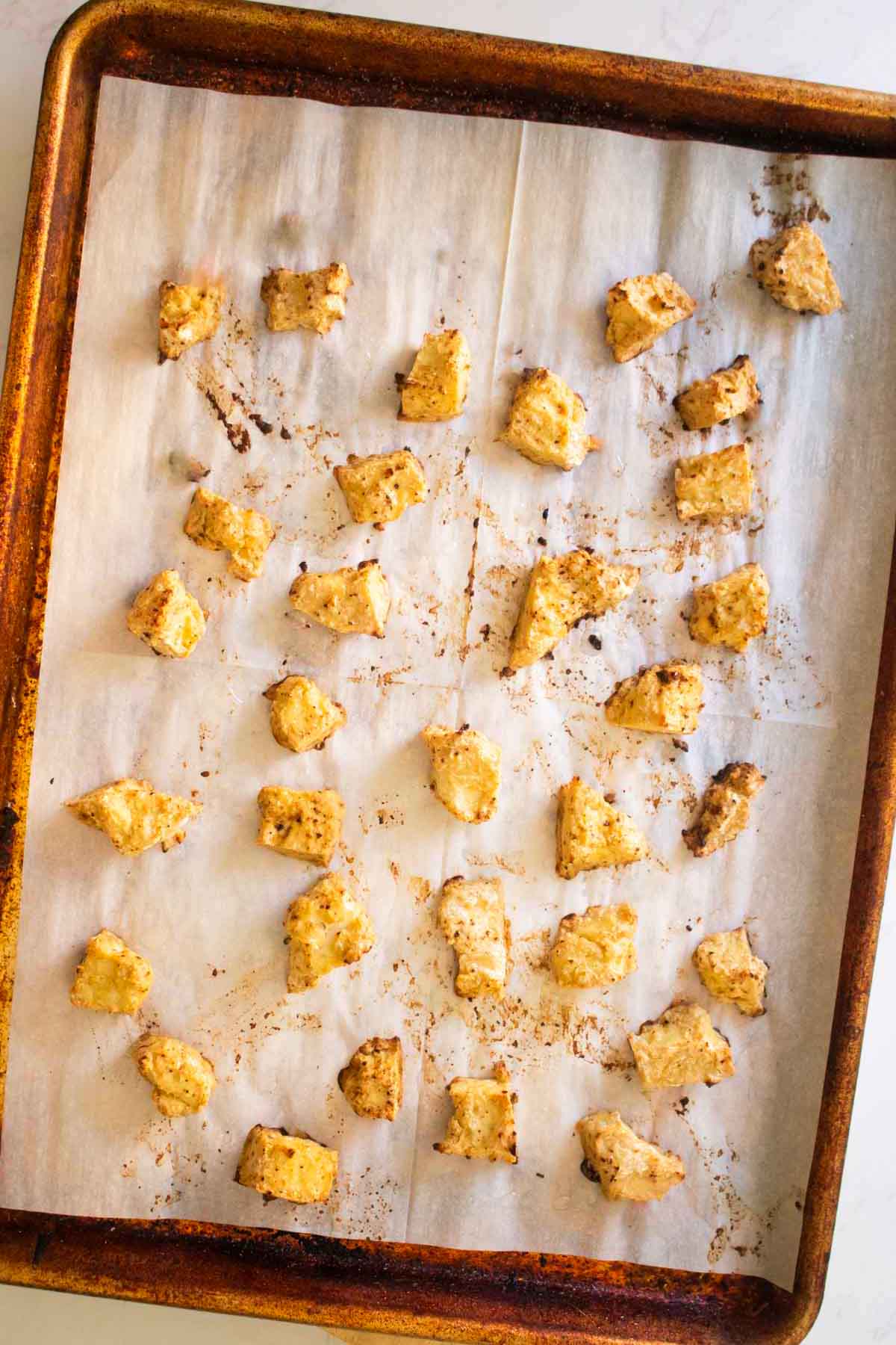 crispy tofu on the baking sheet after baking