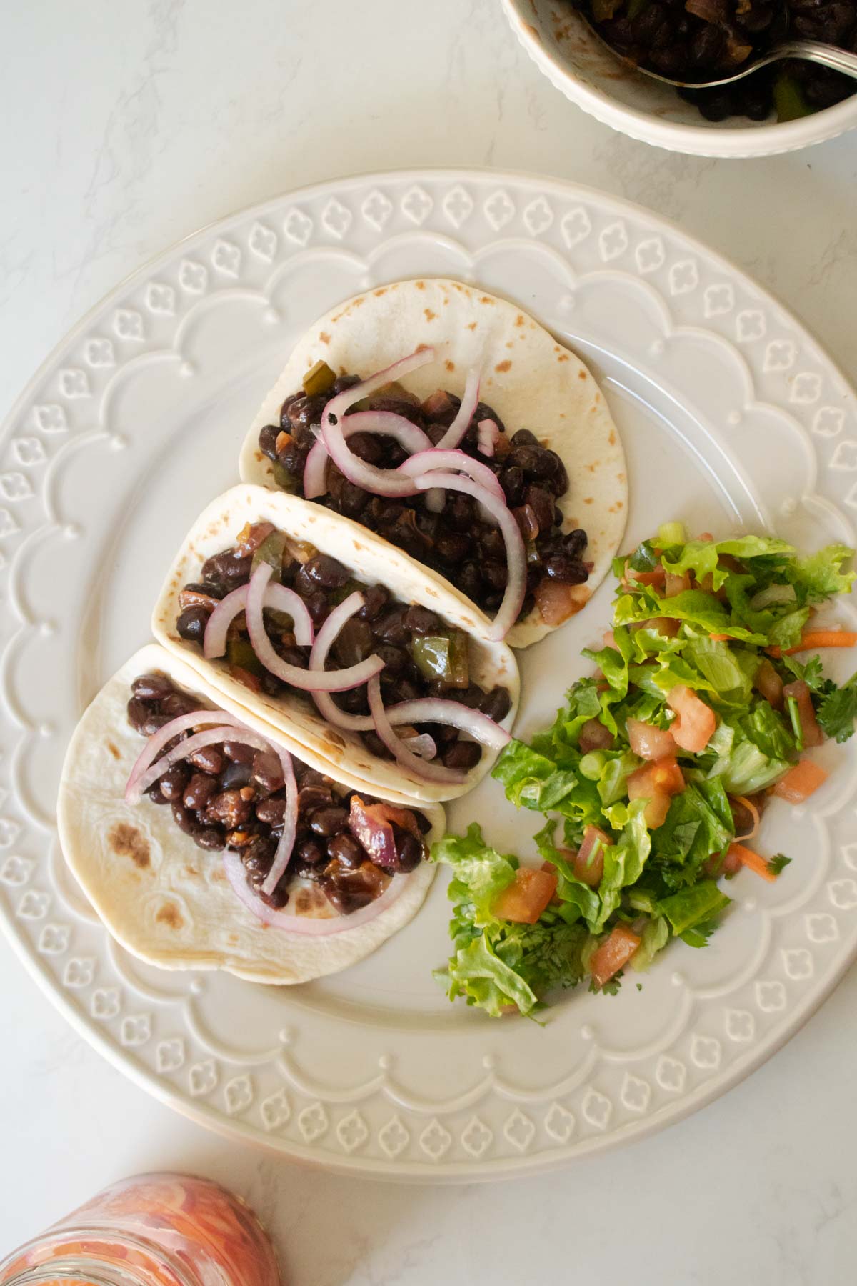 adding pickled onions to vegan black bean tacos