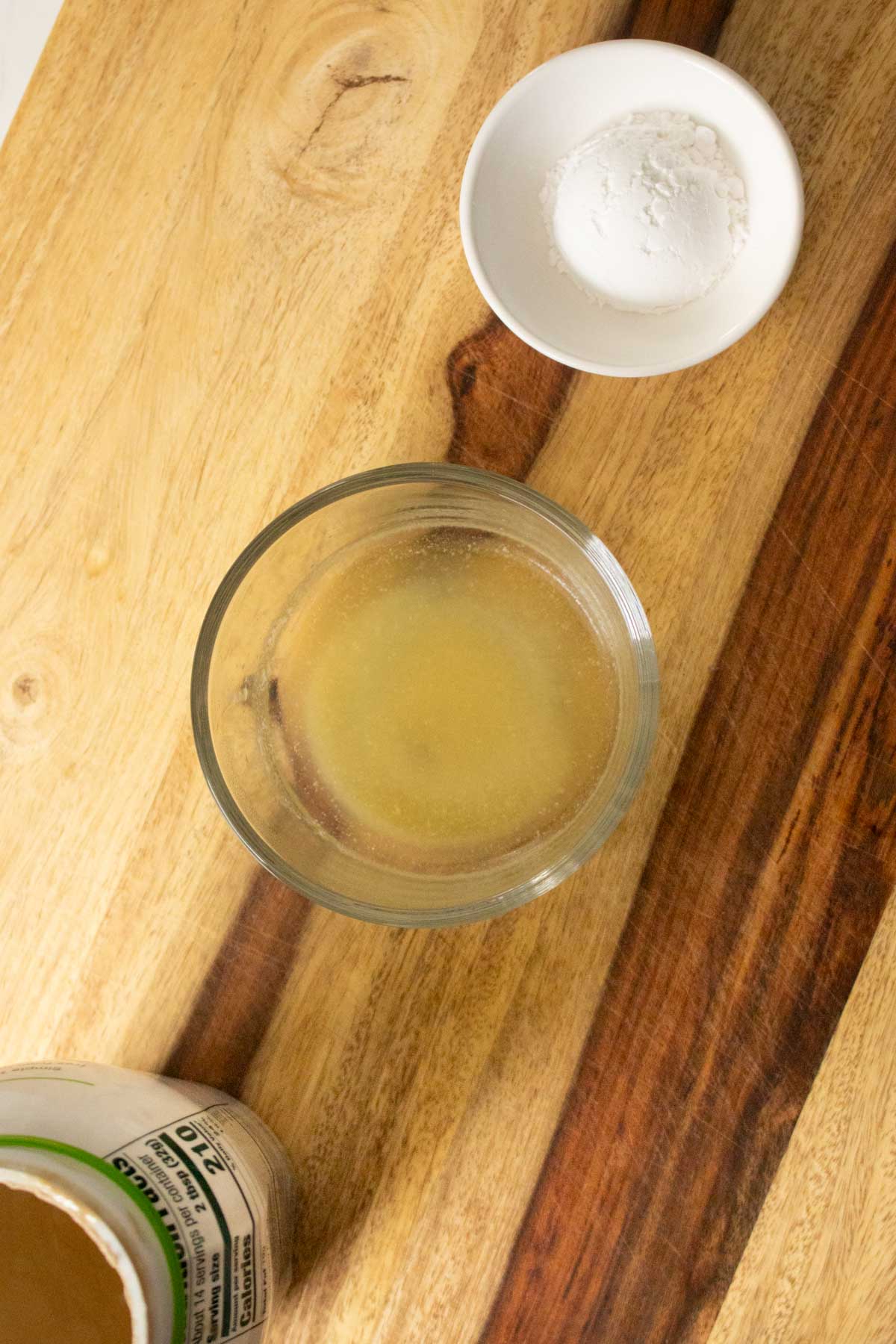 melted vegan butter next to tahini and powdered sugar in bowls