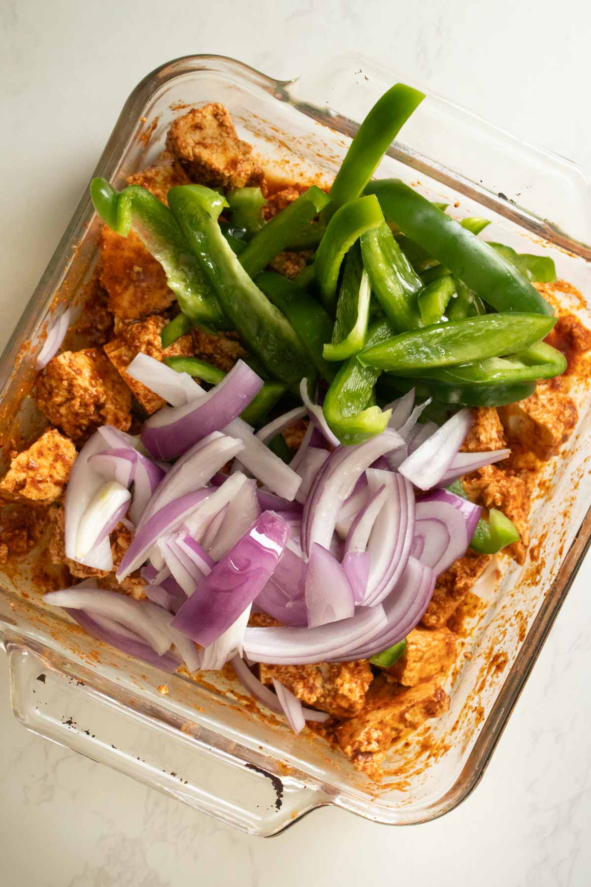 tofu and fajita veggies in the pan before mixing