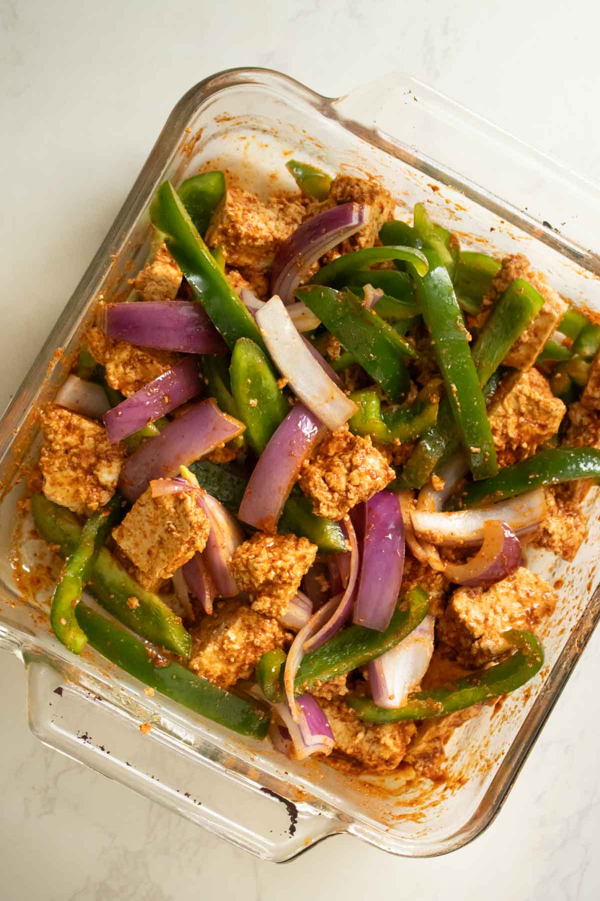 tofu and fajita veggies in the pan after mixing