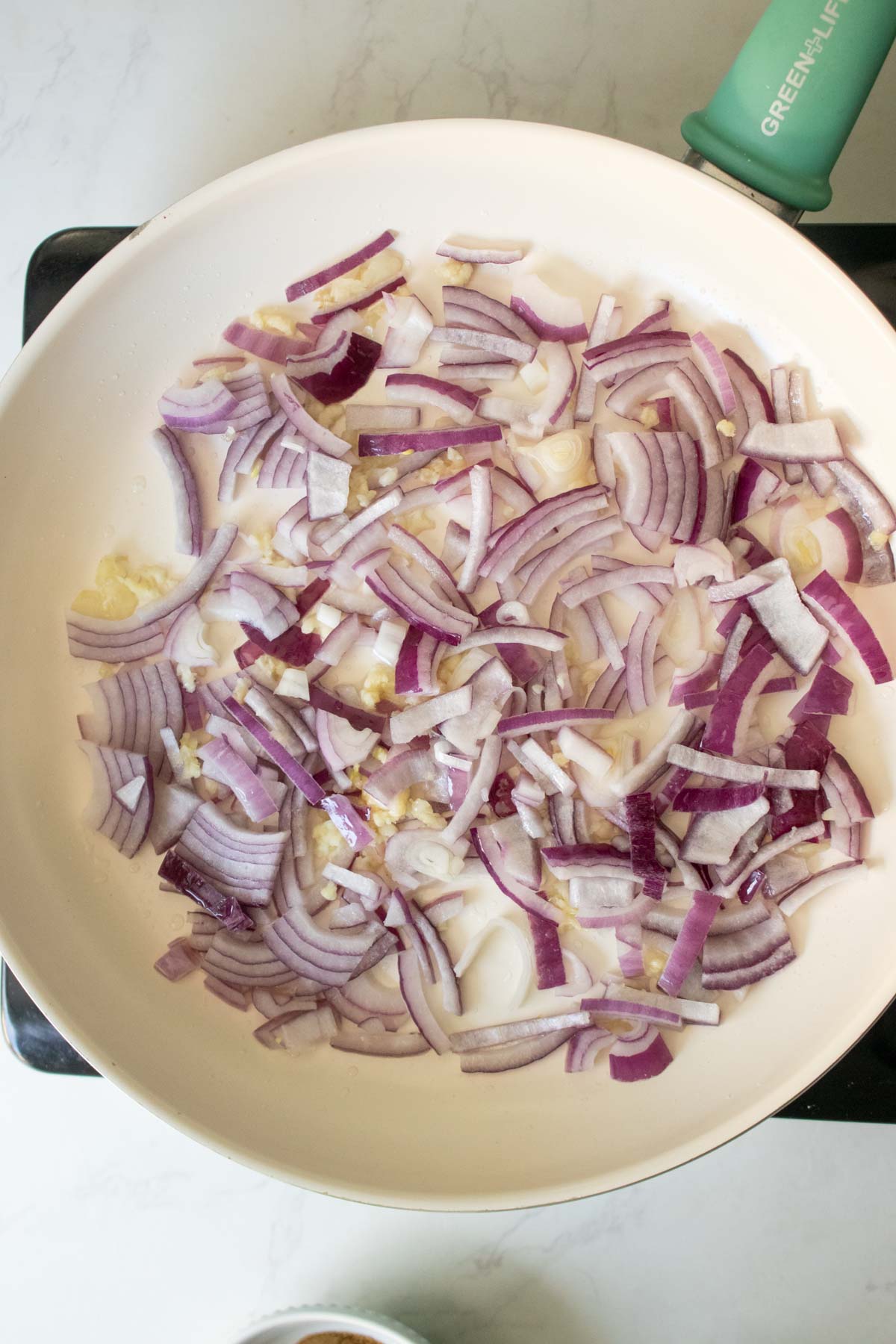 onions in the pan before cooking