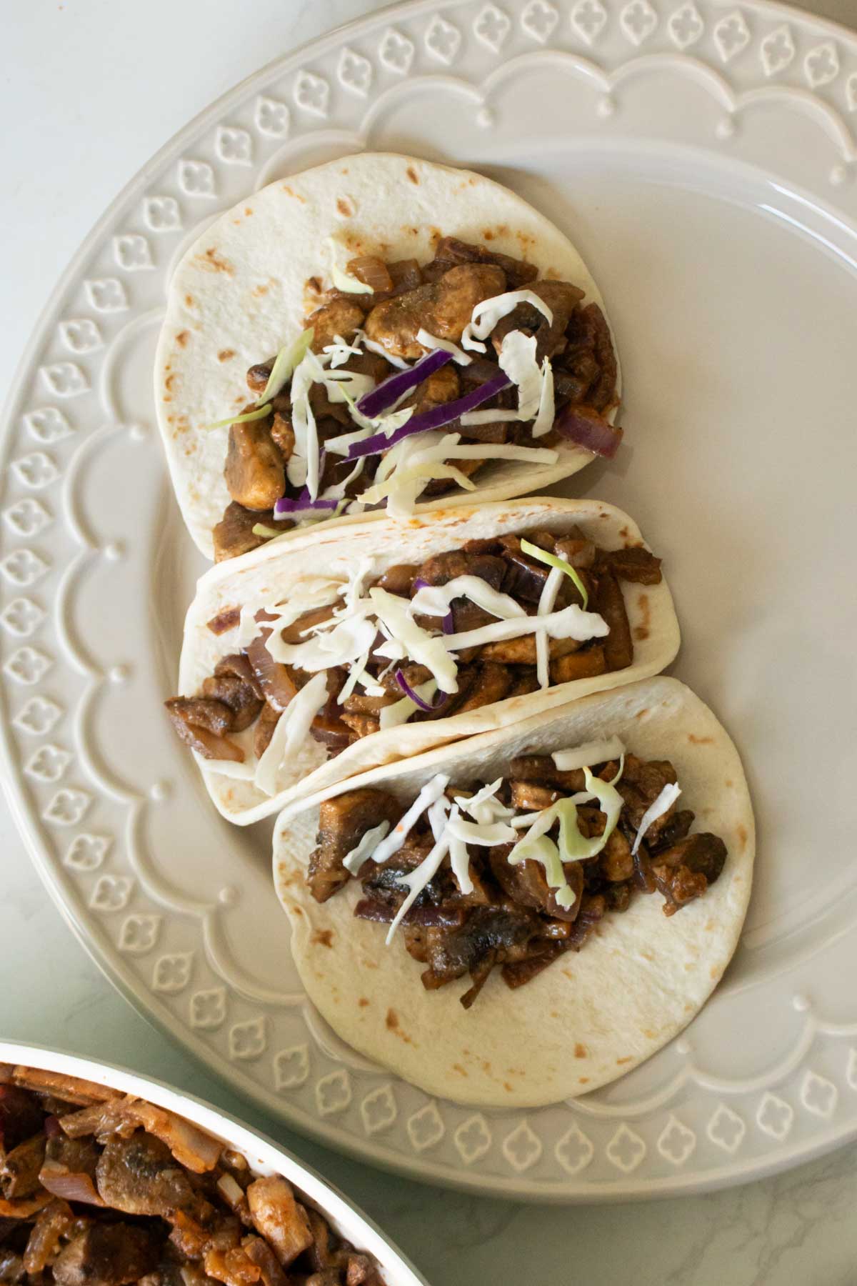 adding cabbage on top of the mushrooms