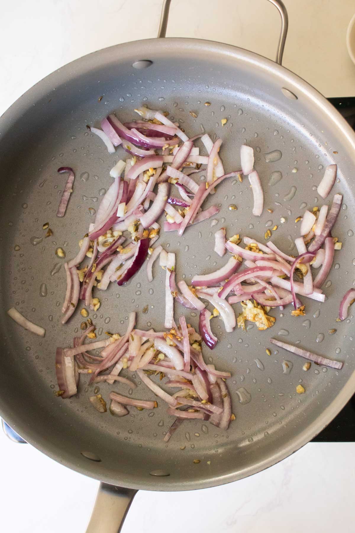 fennel, onion, and garlic in the pan after cooking