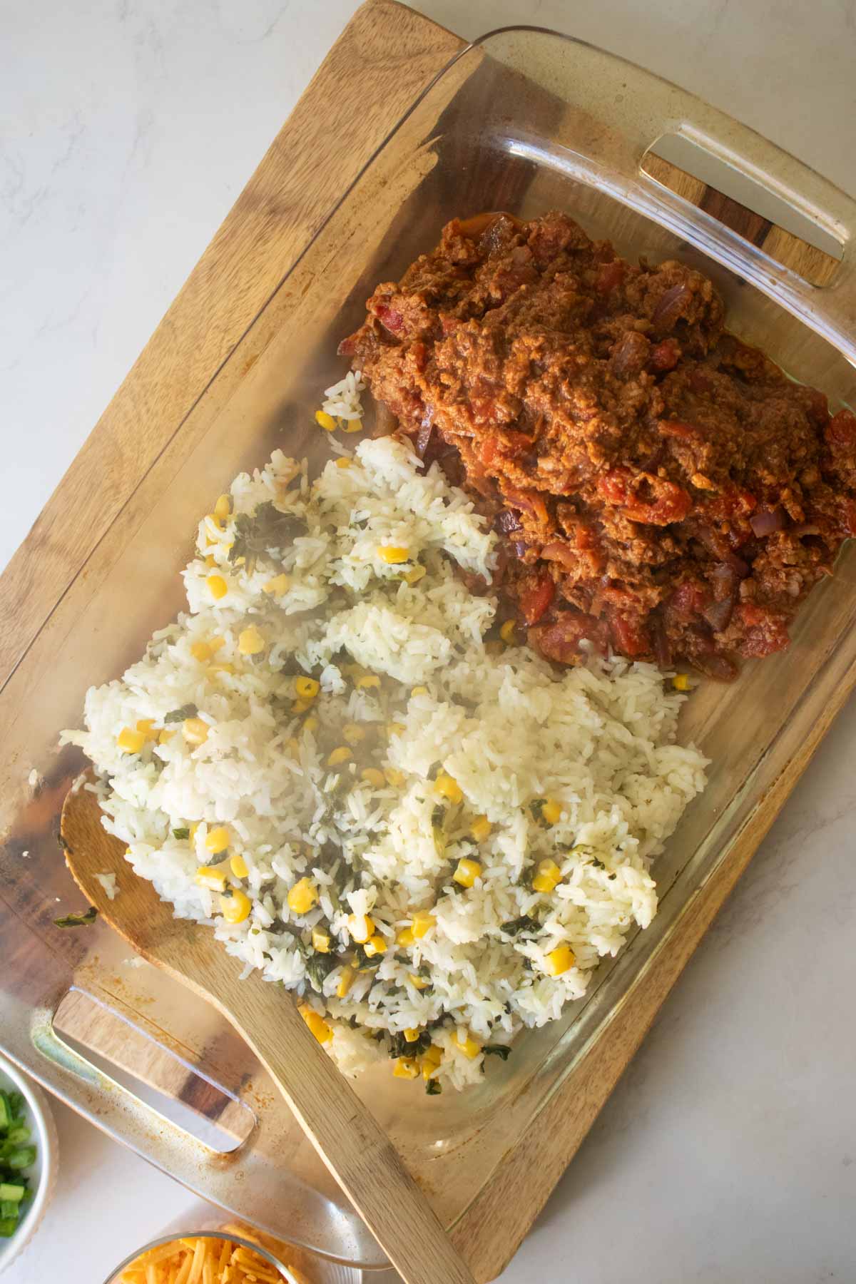 adding rice to the baking pan