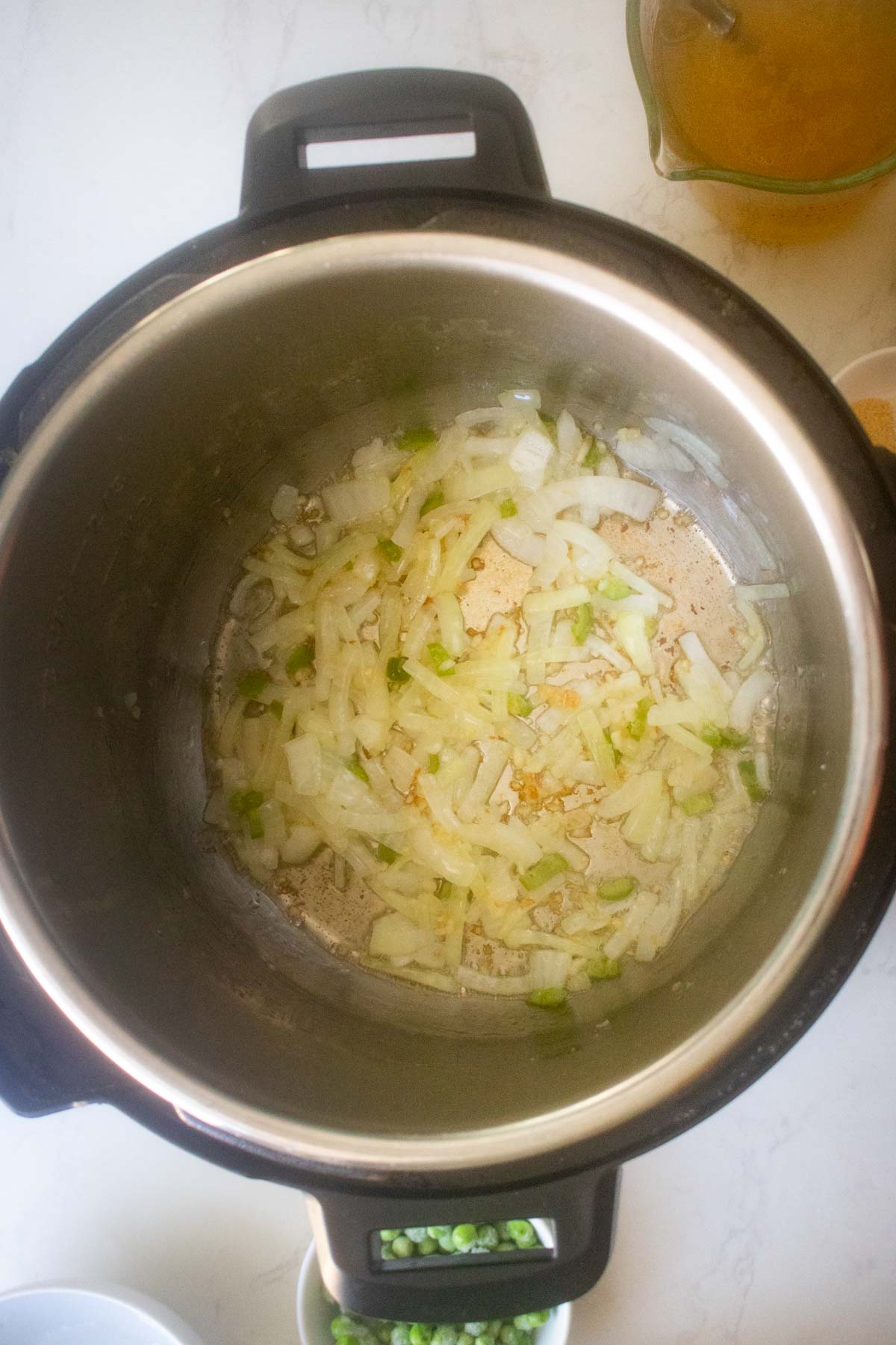 onions, garlic, and chili in the pot after cooking