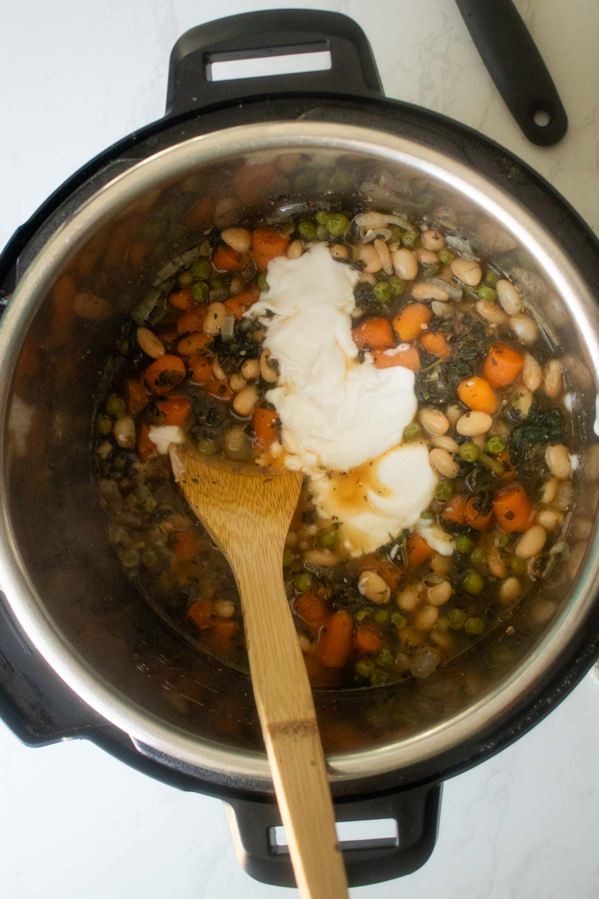 adding yogurt to the pot