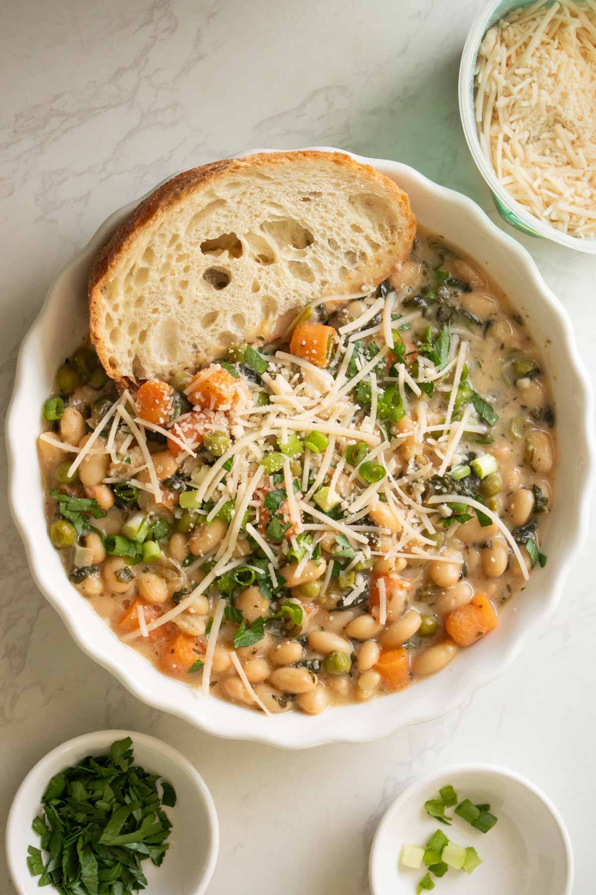 Instant Pot white bean soup with toppings and bread