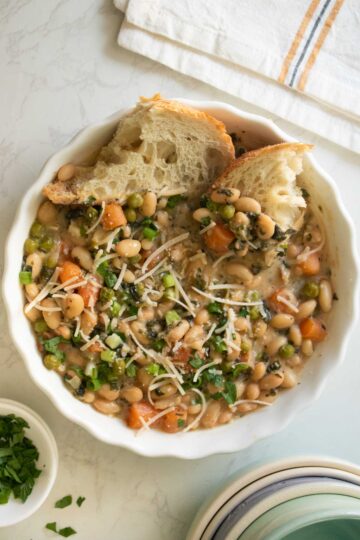 Instant Pot white bean soup with toppings and bread