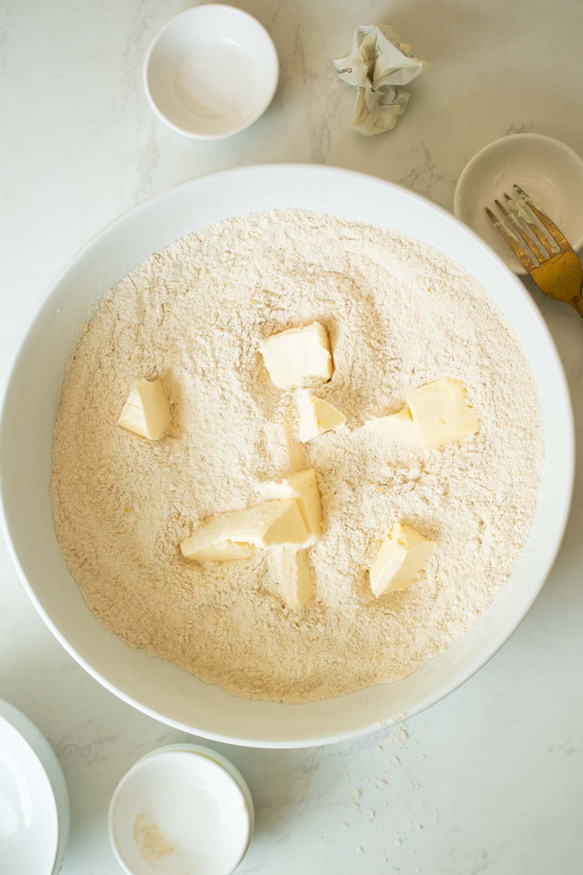 cutting the butter into the dry mixture