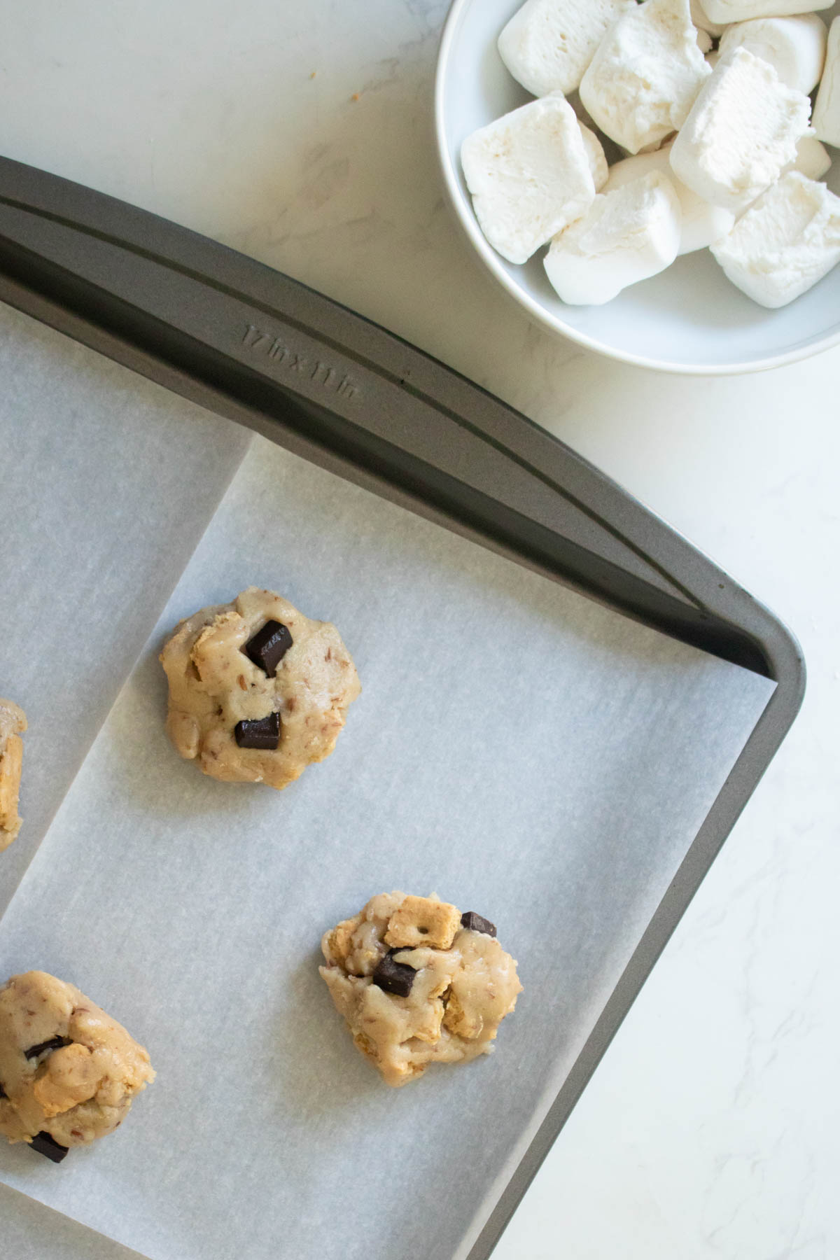 marshmallows and un-topped vegan s'mores cookies