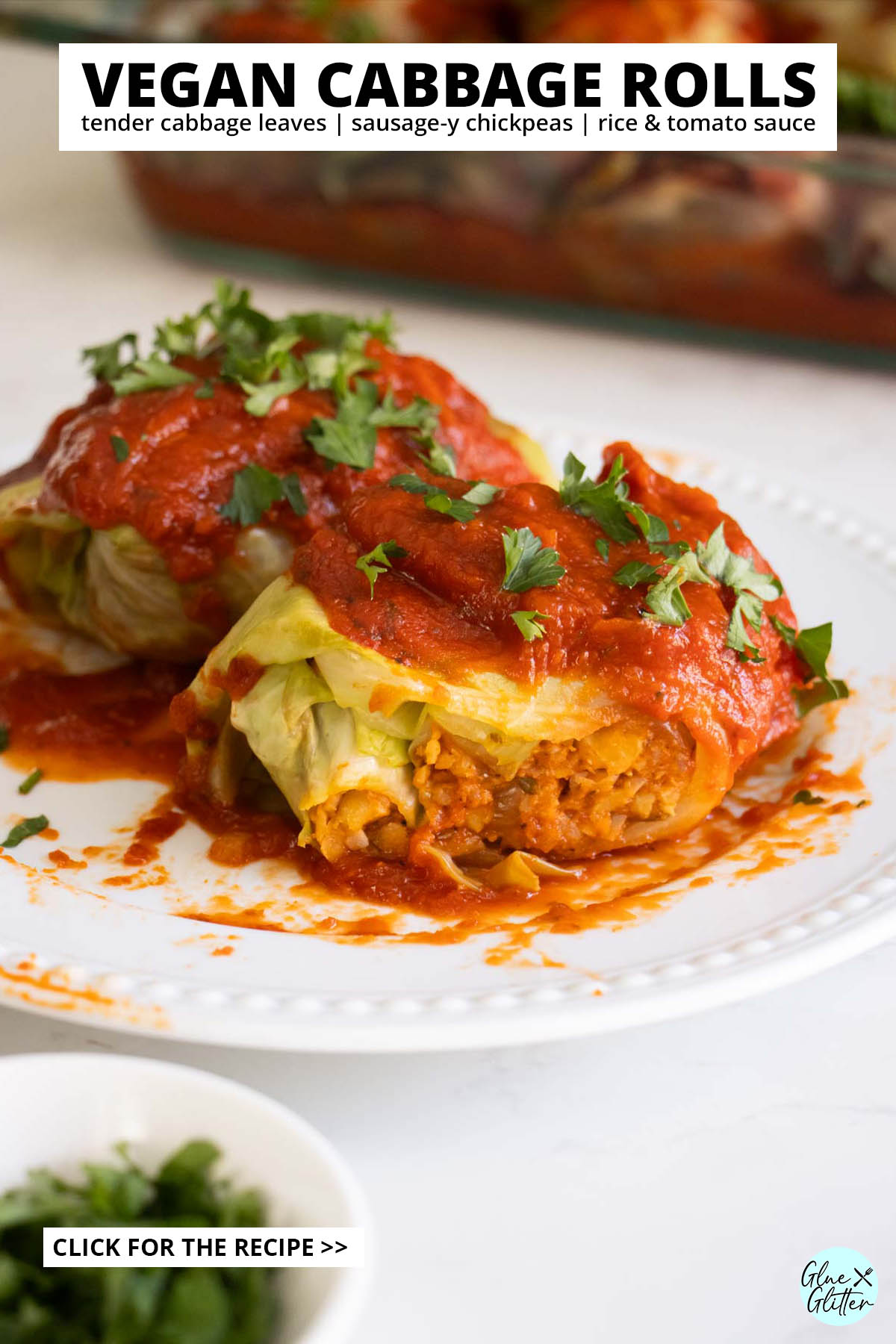vegan rolled cabbage with a bite taken out, so you can see the filling, text overlay