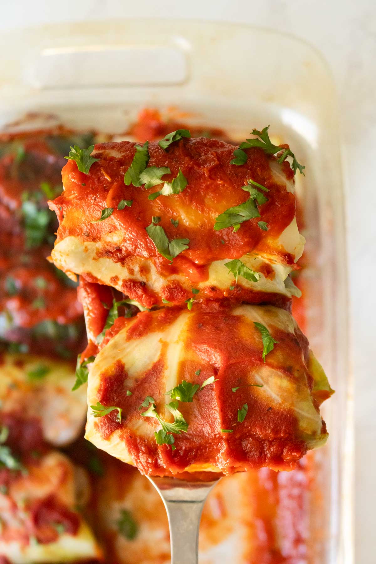 spatula serving vegan cabbage rolls